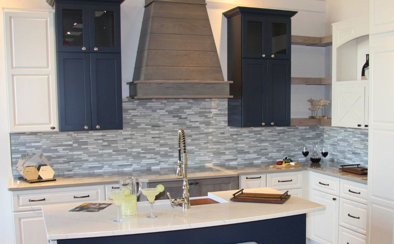 Gray and white tile backsplash at a kitchen display at Kiba Studios