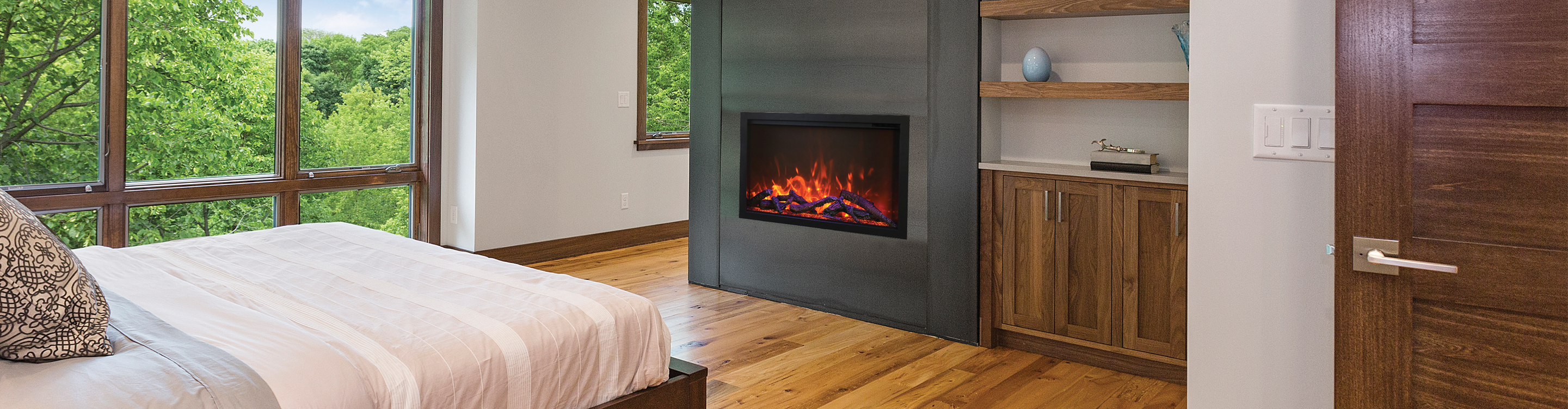 Modern electric fireplace in a bedroom.