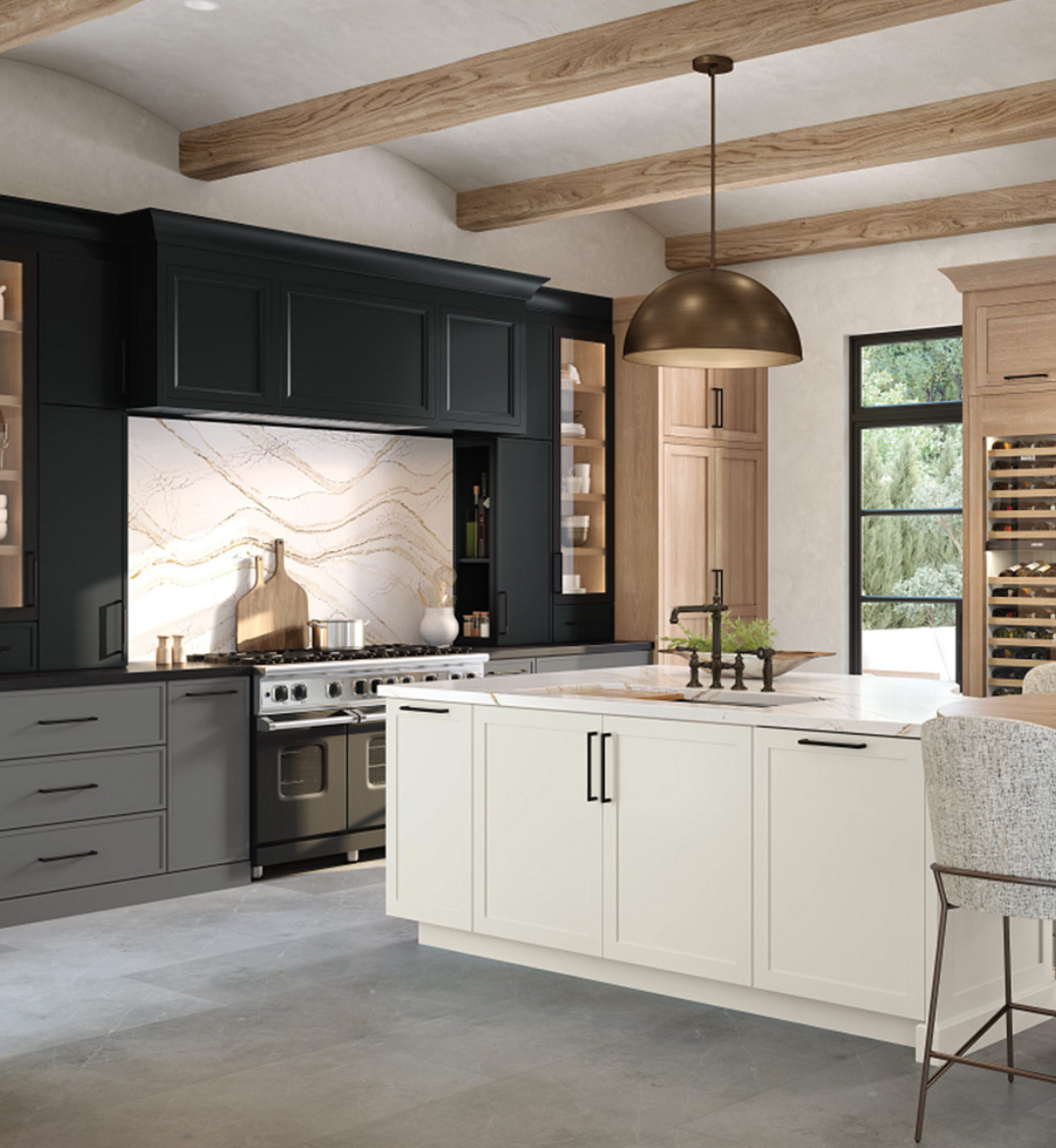 Kitchen featuring matte black hardware on light cabinetry, paired with a marble backsplash and warm wood accents.